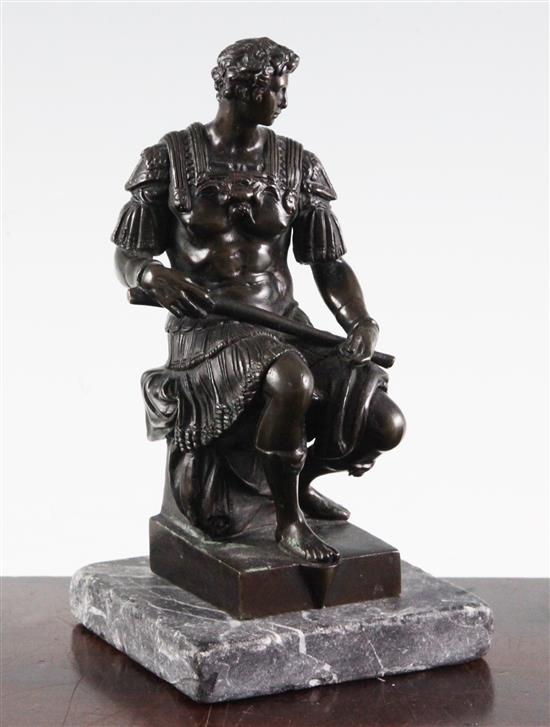 After the antique. A bronze model of a seated Roman soldier, inscribed Michel angelo, 6.5in, on separate marble plinth